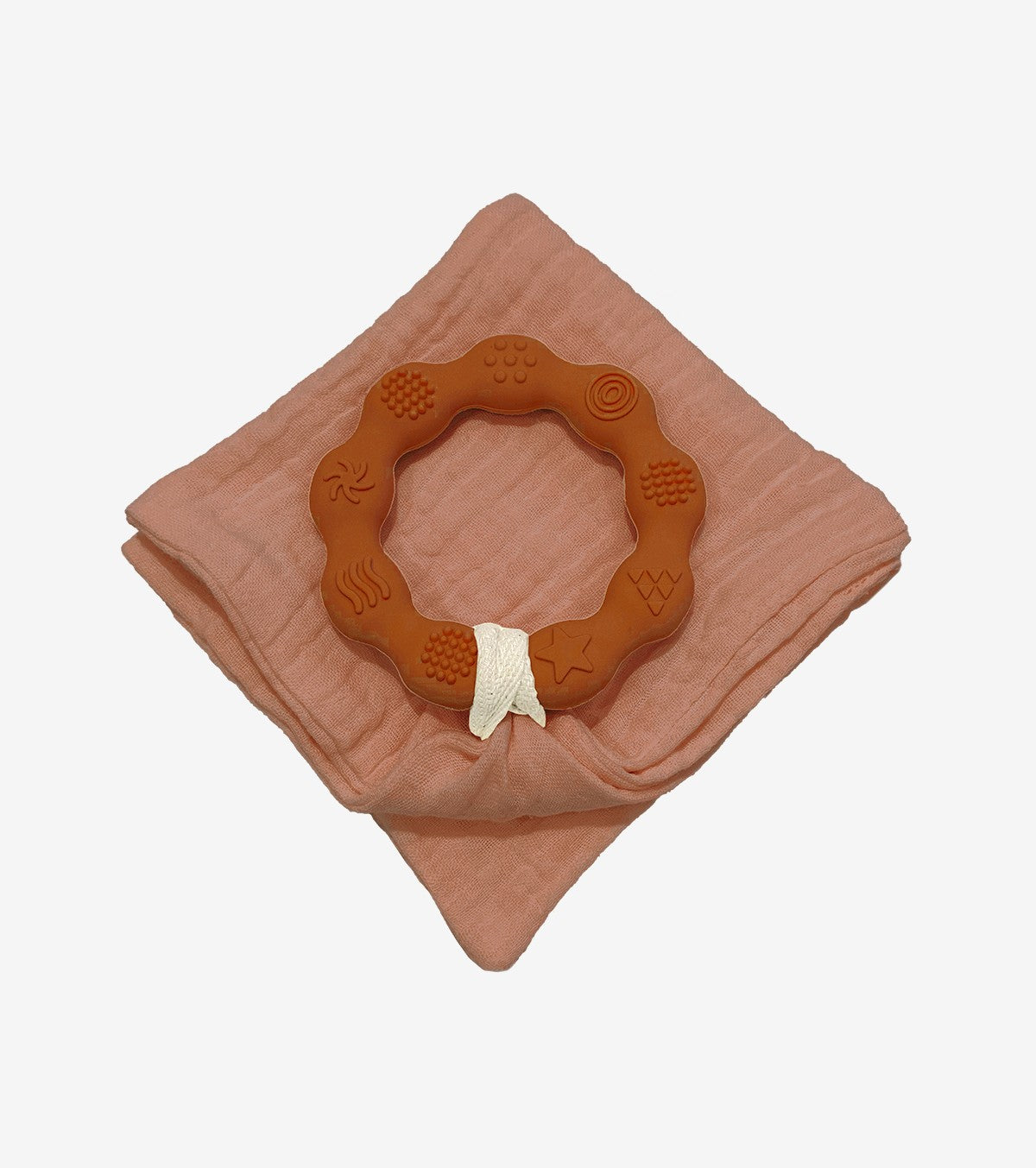 Brown teething ring and diaper